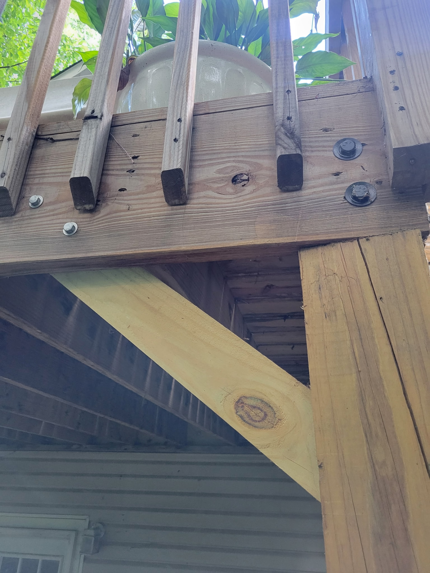 Reinforced back porch support beam and framing from one angle